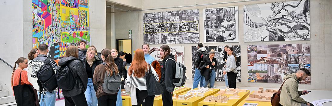 A group of students standing in the atrium of Building 6.