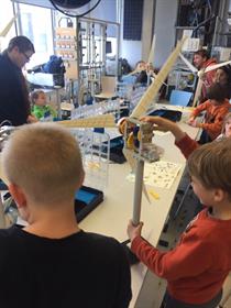 A group of children builds a mini wind turbine