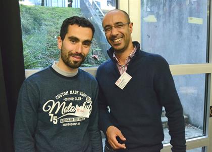Two international students laughing at the Welcome Café